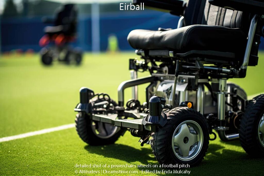 detailed shot of a powerchairs wheels on a football pitch